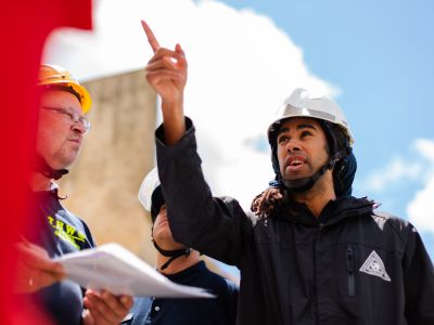 Male structural engineer leading team